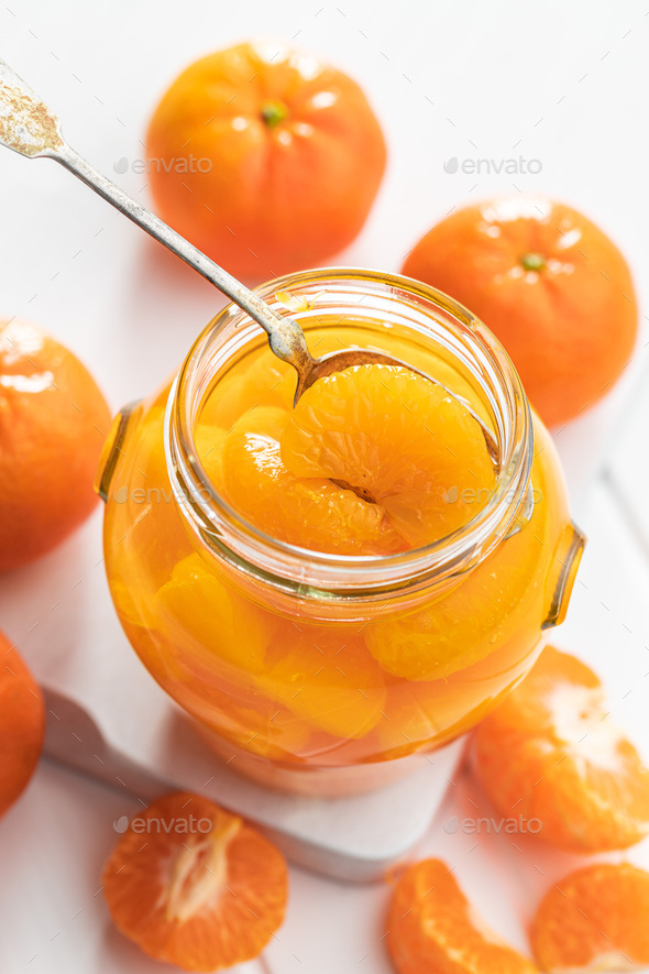 Canned tangerine. Pickled mandarin fruit in jar. Stock Photo by jirkaejc